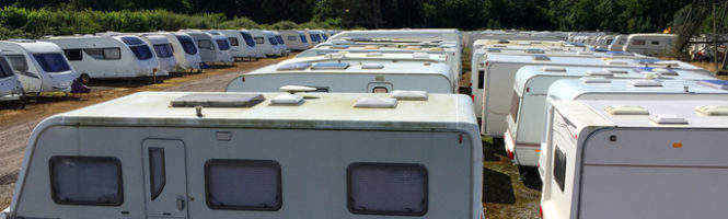 buying Caravans stored in rows on a sunny day.a used rv checklist