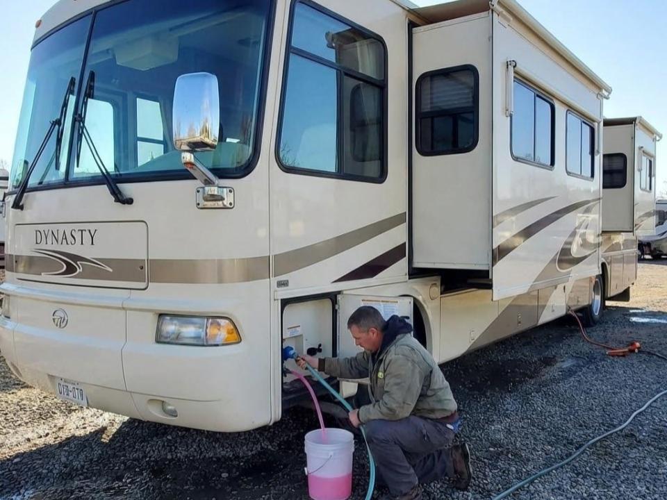 A man teaching us on how to dewinterize your rv
