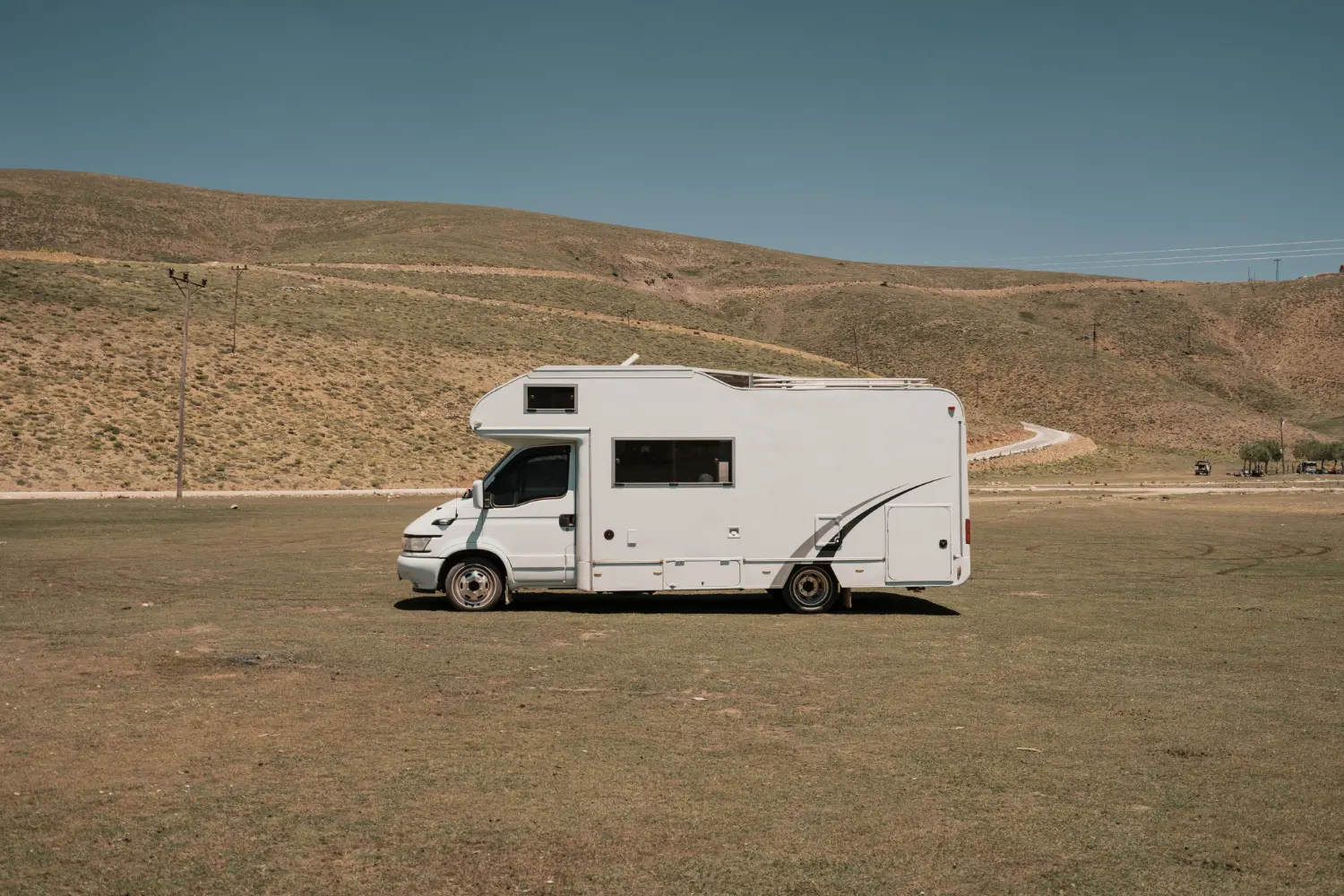 An RV somewhere on a desert road for a road trip